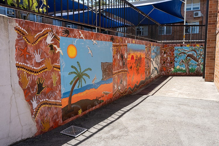 Murals painted on a school wall.